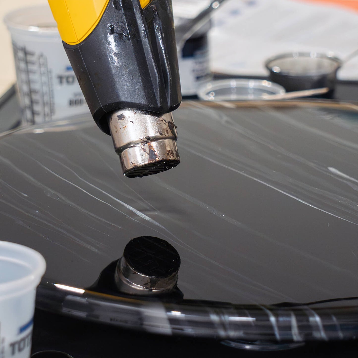 TotalBoat Epoxy Black Marble Effect Countertop Kit using a heat gun to remove bubbles from poured epoxy