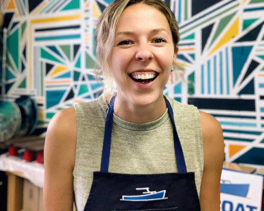 Meghan Miller La Marée Art smiling in TotalBoat apron